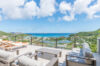 Terrace lounge with cushioned seating and panoramic Caribbean Sea views at a hillside luxury St Barts villa rental.