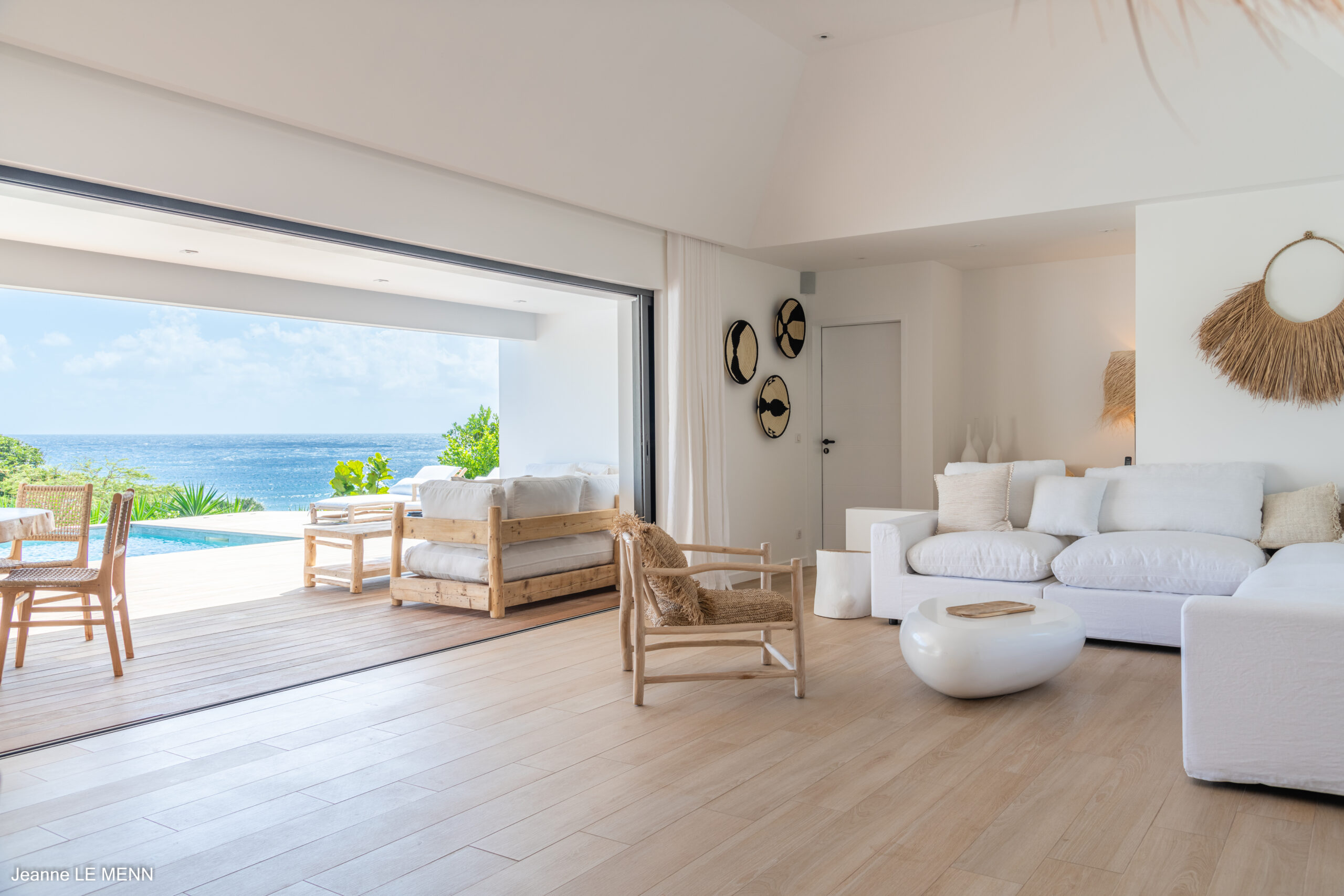 Spacious villa living area in St Barts with modern design, high ceilings, and ocean views.
